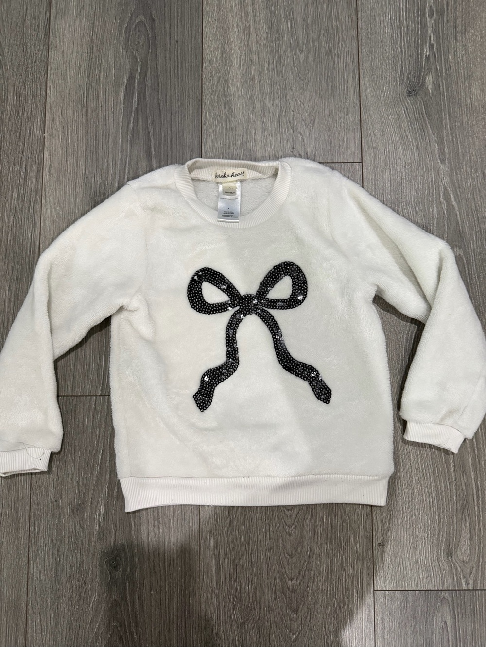 Derek Heart White Fuzzy Sweatshirt with Black Sequin Bow
